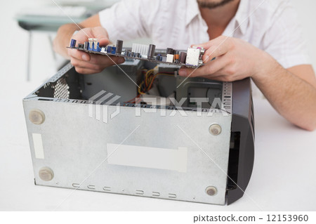Computer engineer working on broken cpu 12153960