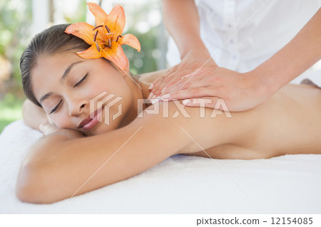 Beautiful brunette enjoying a back massage 12154085