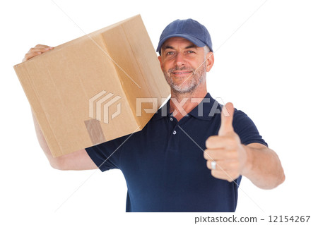 Happy delivery man holding cardboard box showing thumbs up 12154267
