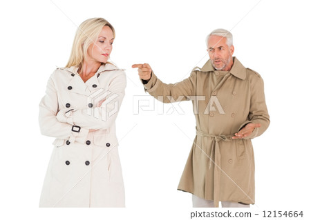Angry couple fighting in trench coats 12154664