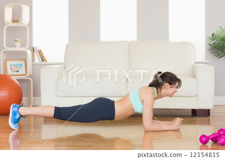 Fit brunette in plank position 12154815