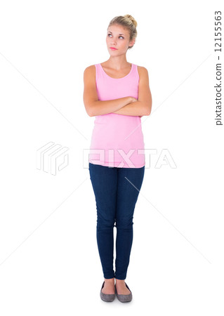 Pretty young blonde in pink thinking with arms crossed Pretty young blonde in pink thinking with arms crossed 12155563
