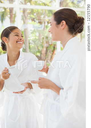 Beautiful friends enjoying herbal tea Beautiful friends enjoying herbal tea 12155790