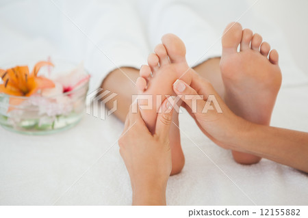 Woman receiving a foot massage Woman receiving a foot massage 12155882