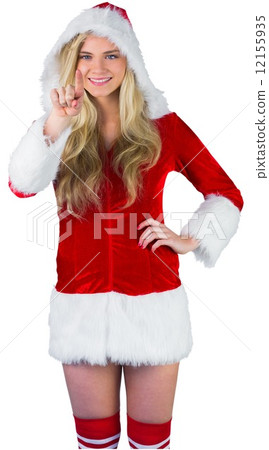 Pretty girl in santa outfit pointing 12155935