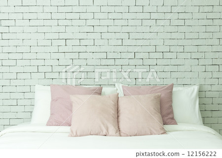 The bed on white bricks wall background The bed on white bricks wall background 12156222