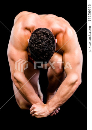 Full length of a shirtless muscular man 12156666