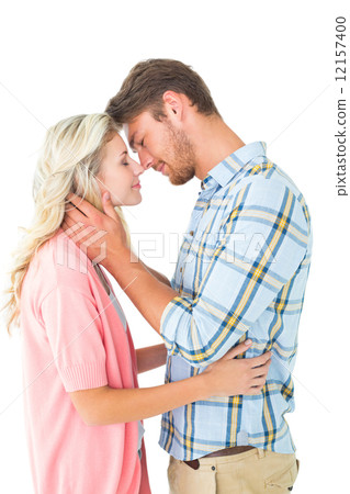 Attractive couple smiling at each other and hugging 12157400