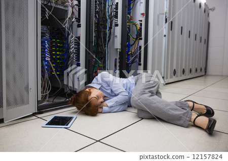 Exhausted technician sleeping on the floor Exhausted technician sleeping on the floor 12157824
