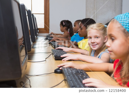 Cute pupils in computer class Cute pupils in computer class 12158400