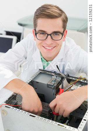 Technician working on broken cpu with soldering iron 12159231