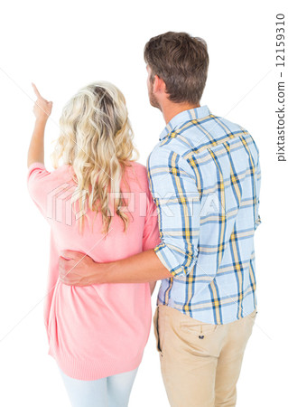 Attractive couple standing and looking 12159310