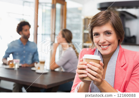 Pretty brunette enjoying her coffee 12160088