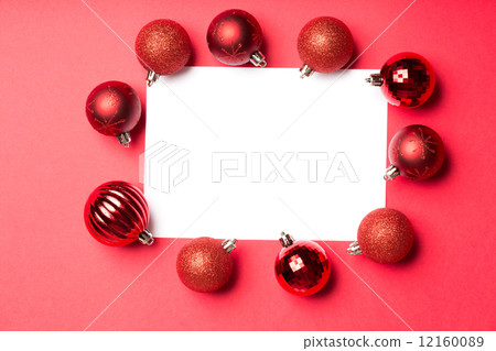 White page surrounded by christmas baubles 12160089