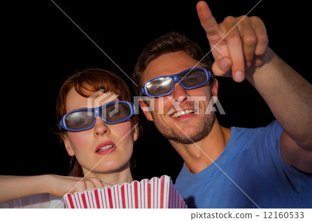 Couple enjoying a movie night Couple enjoying a movie night 12160533