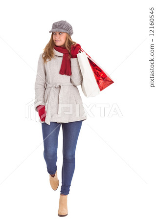 Happy blonde in winter clothes with bags 12160546