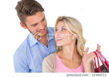 Attractive young couple with shopping bags 12160711