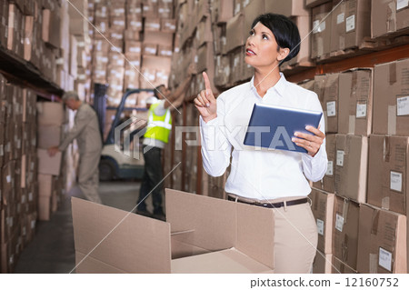 Pretty warehouse manager using tablet pc 12160752
