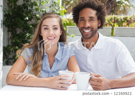 Happy couple having coffee together Happy couple having coffee together 12160922