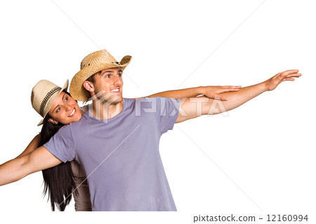 Man giving his pretty girlfriend a piggy back 12160994