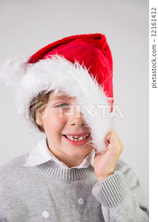 Child wearing a santa hat Child wearing a santa hat 12161412