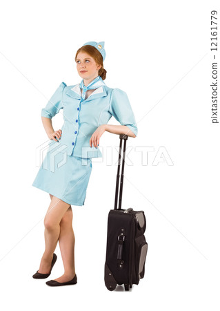 Pretty air hostess leaning on suitcase Pretty air hostess leaning on suitcase 12161779