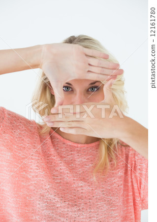 Young woman making frame with her hands 12161780