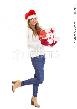 Festive blonde holding pile of gifts Festive blonde holding pile of gifts 12162032