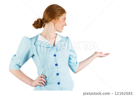 Pretty air hostess presenting with hand Pretty air hostess presenting with hand 12162085