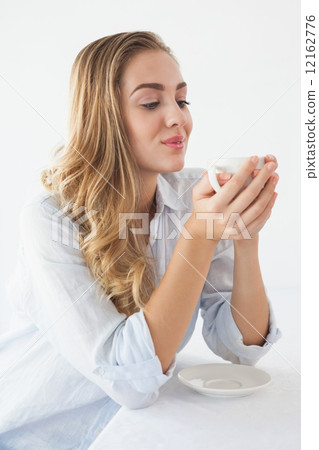Pretty blonde having a coffee 12162776