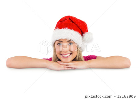 Festive blonde leaning on large poster Festive blonde leaning on large poster 12162909