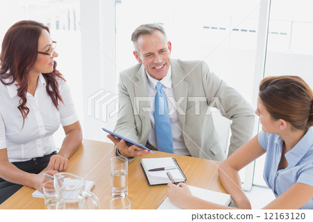 Business team in a meeting Business team in a meeting 12163120