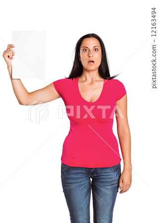 Shocked woman holding piece of paper 12163494
