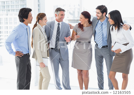 Business team chatting and smiling 12163505