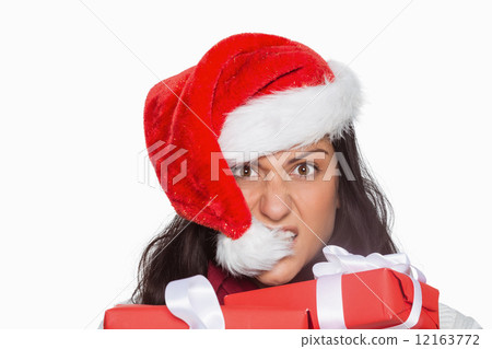图库照片: irritated woman with christmas presents