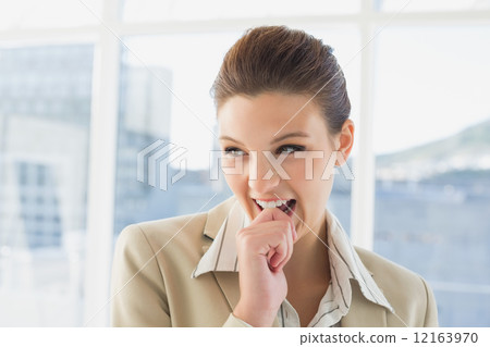 Pretty businesswoman looking and smiling 12163970