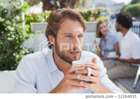 Thoughtful man having a coffee Thoughtful man having a coffee 12164035