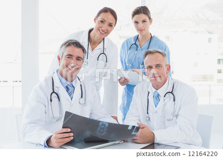 Doctor holding up an x-ray 12164220