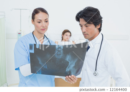 Nurse and doctor with x-ray Nurse and doctor with x-ray 12164400