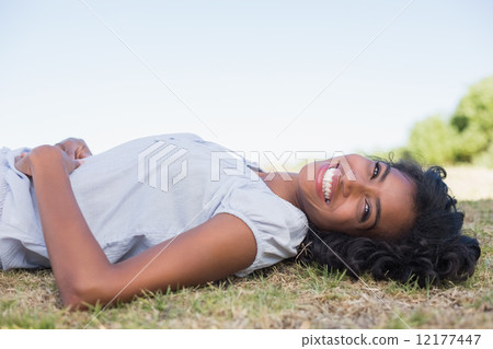 Casual pretty woman lying on the grass Casual pretty woman lying on the grass 12177447