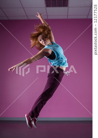 Pretty break dancer leaping mid air Pretty break dancer leaping mid air 12177528