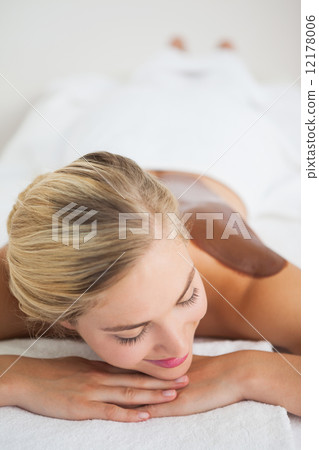 Beautiful blonde enjoying a chocolate beauty treatment Beautiful blonde enjoying a chocolate beauty treatment 12178006