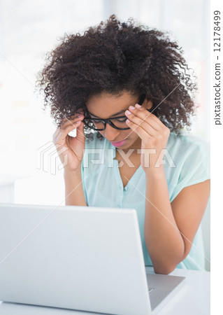 Stressed hipster businesswoman working on laptop Stressed hipster businesswoman working on laptop 12178499