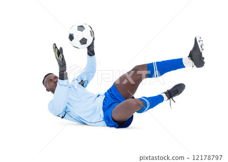 Goalkeeper in blue making a save 12178797