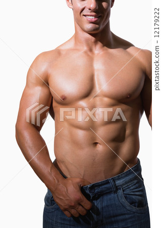 Mid section of a shirtless muscular man Mid section of a shirtless muscular man 12179222