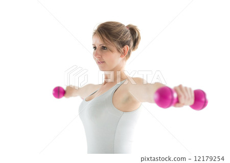 Young woman exercising with dumbbells Young woman exercising with dumbbells 12179254