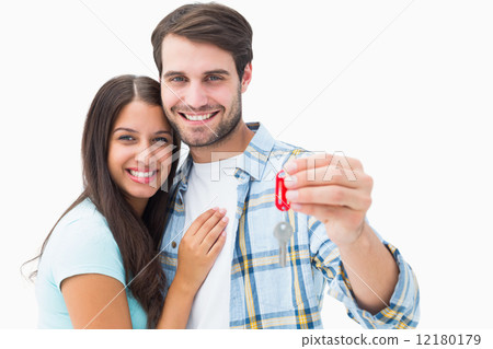 Happy young couple holding new house key 12180179