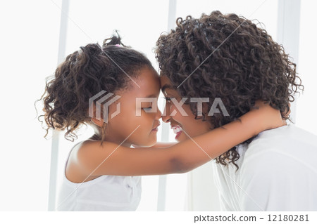 Cute little girl hugging her mother Cute little girl hugging her mother 12180281