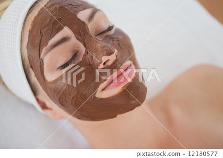 Beautiful blonde getting a chocolate facial treatment 12180577