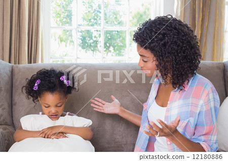 Pretty mother scolding her daughter on the couch 12180886